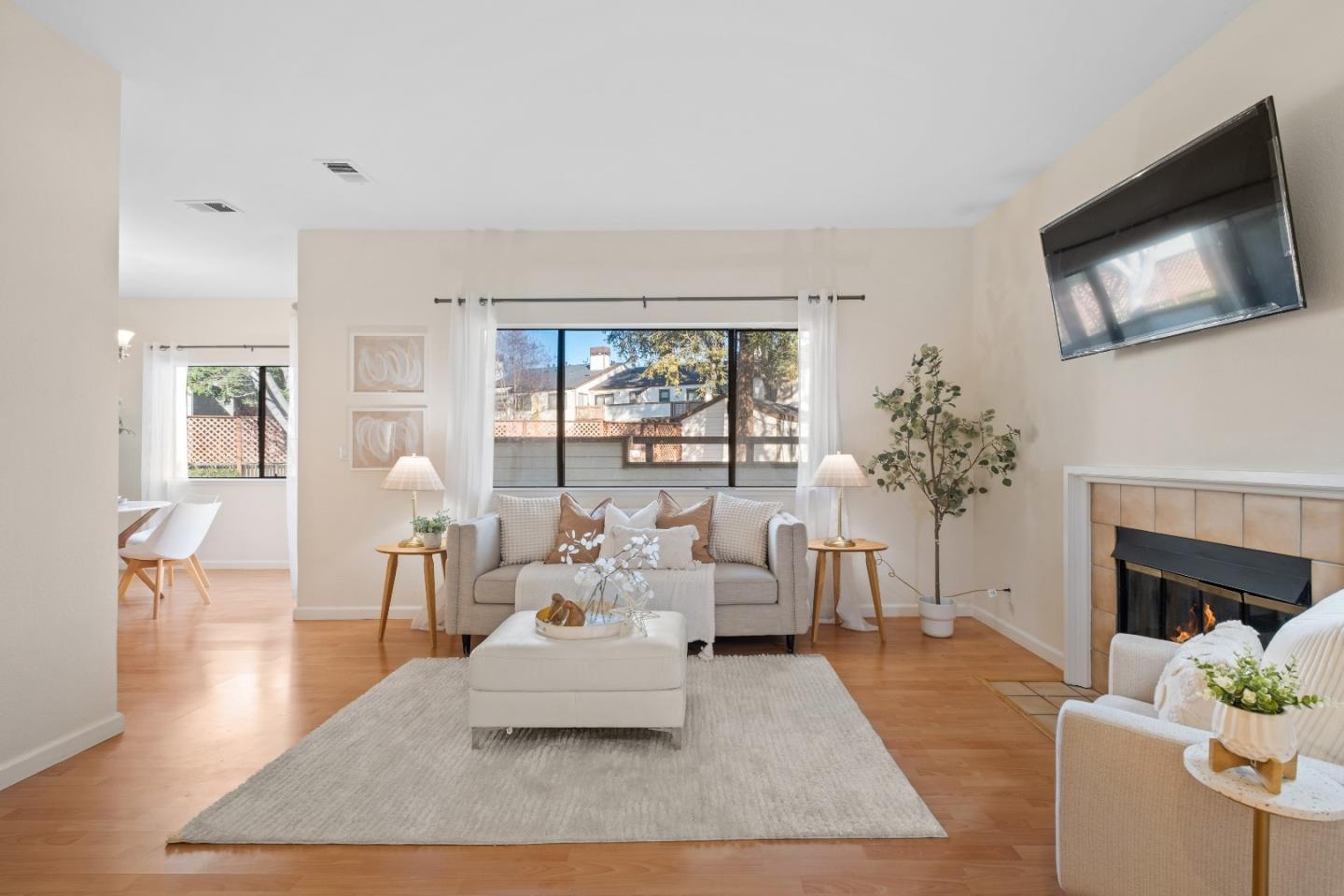 a living room with furniture fireplace and a flat screen tv