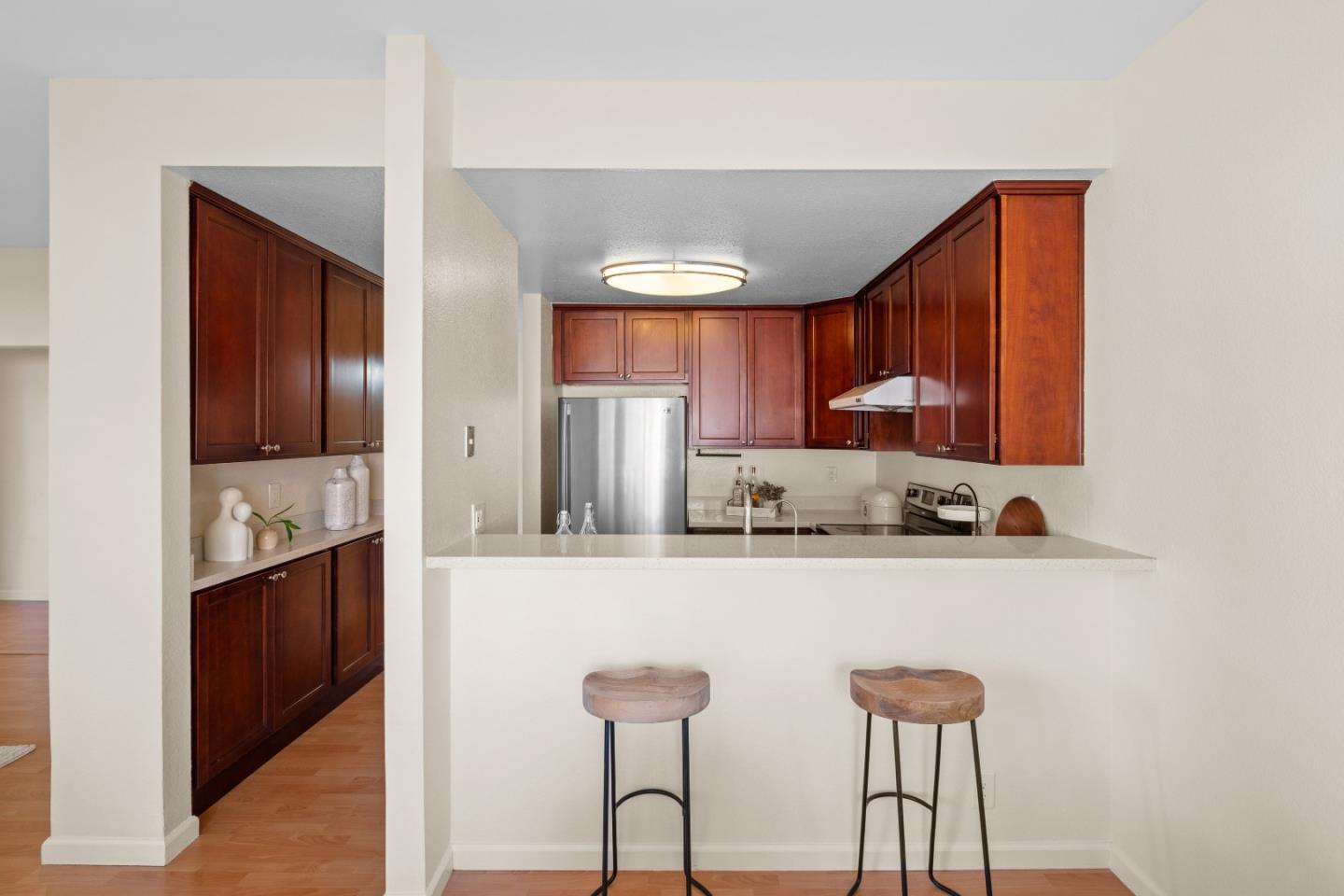 1392 Meadow Ridge Circle San Jose, CA 95131 - Photo 11 of 43 a kitchen with stainless steel appliances a sink and cabinets