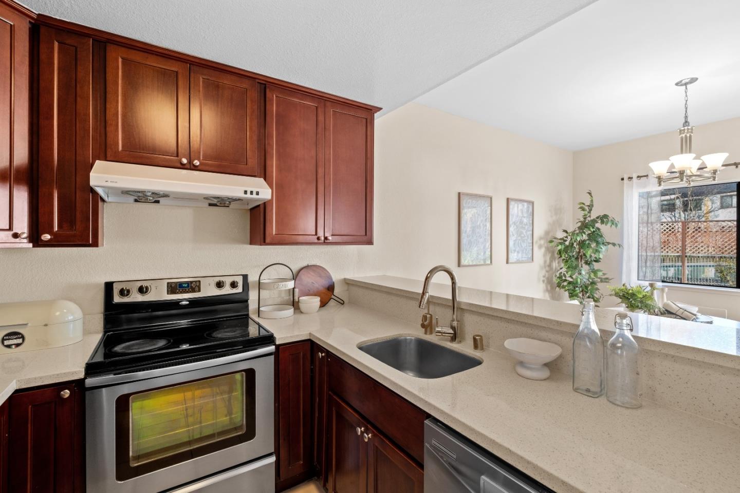1392 Meadow Ridge Circle San Jose, CA 95131 - Photo 13 of 43 a kitchen with sink a stove and cabinets