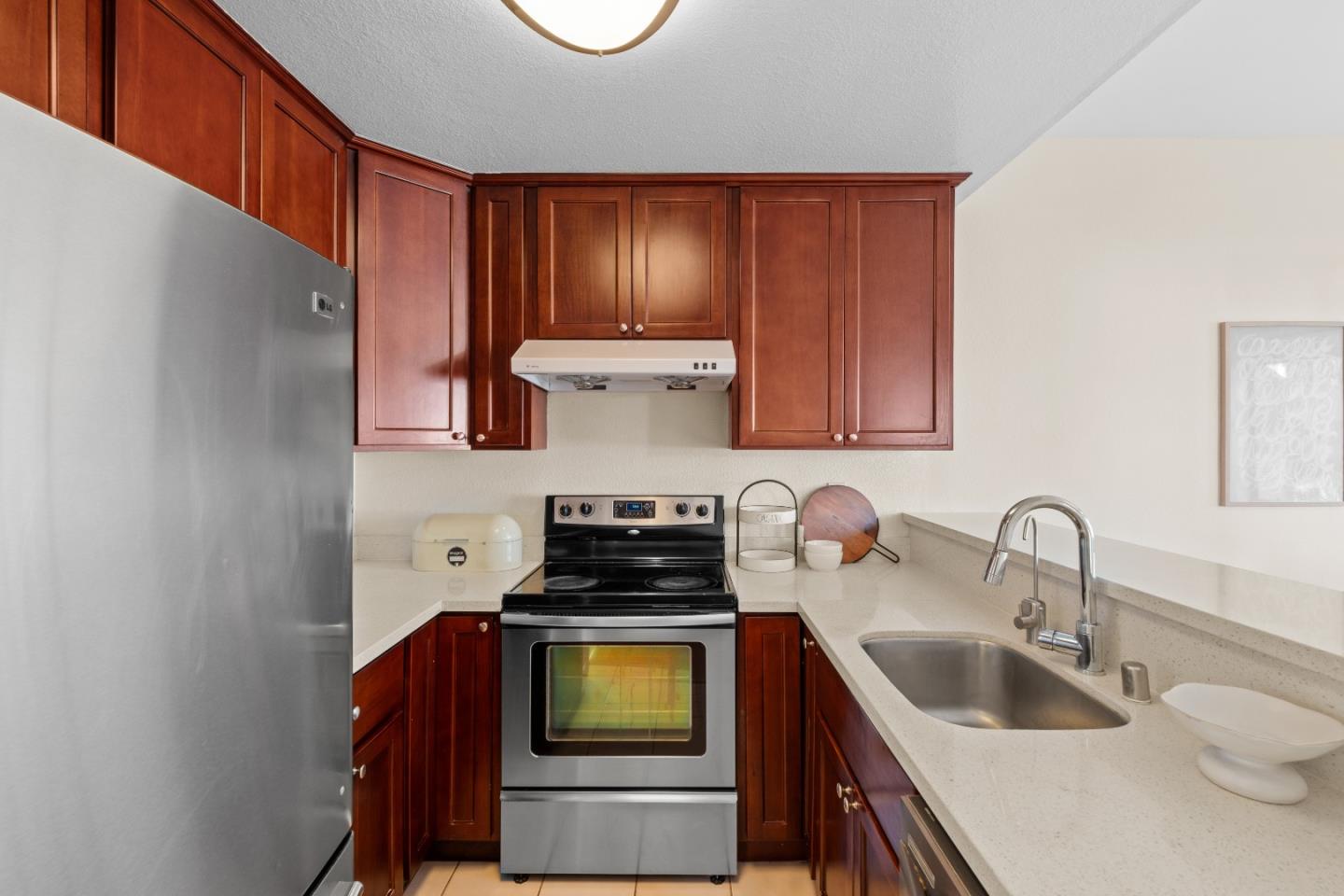 1392 Meadow Ridge Circle San Jose, CA 95131 - Photo 15 of 43 a kitchen with a sink a stove and cabinets