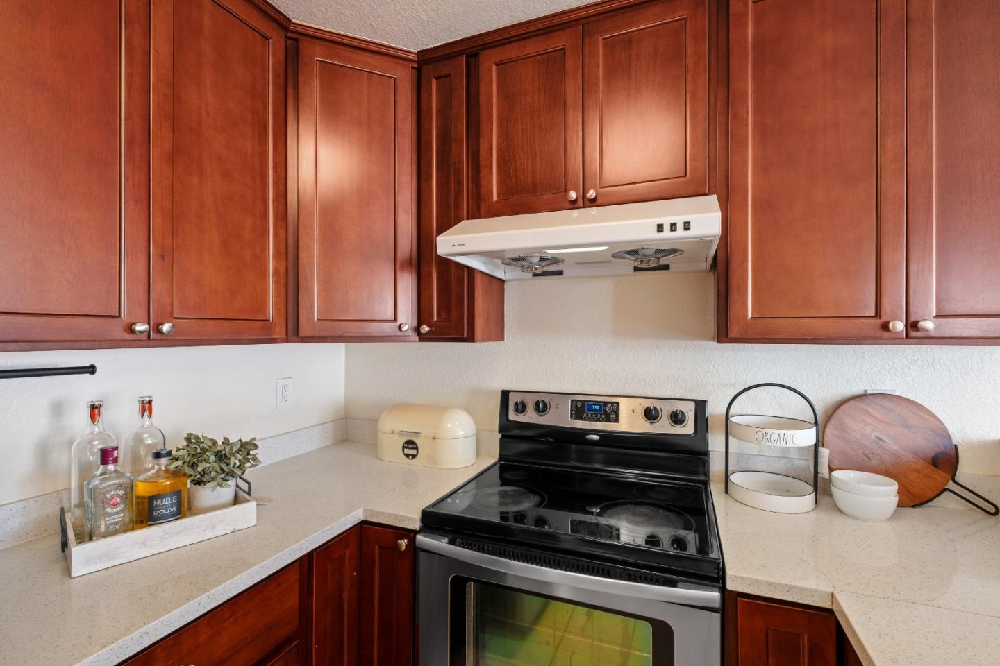 1392 Meadow Ridge Circle San Jose, CA 95131 - Photo 17 of 43 a kitchen with stainless steel appliances granite countertop a refrigerator and a stove top oven