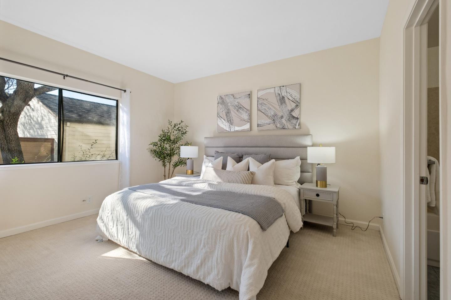 1392 Meadow Ridge Circle San Jose, CA 95131 - Photo 20 of 43 a bedroom with a bed and window