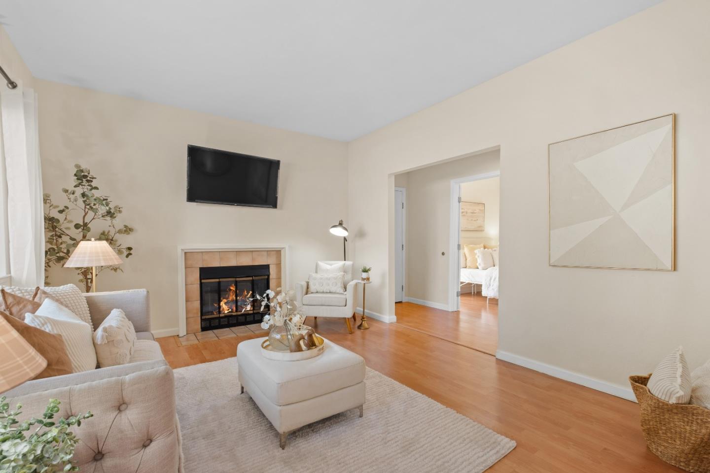 1392 Meadow Ridge Circle San Jose, CA 95131 - Photo 2 of 43 a living room with furniture a fireplace and a flat screen tv
