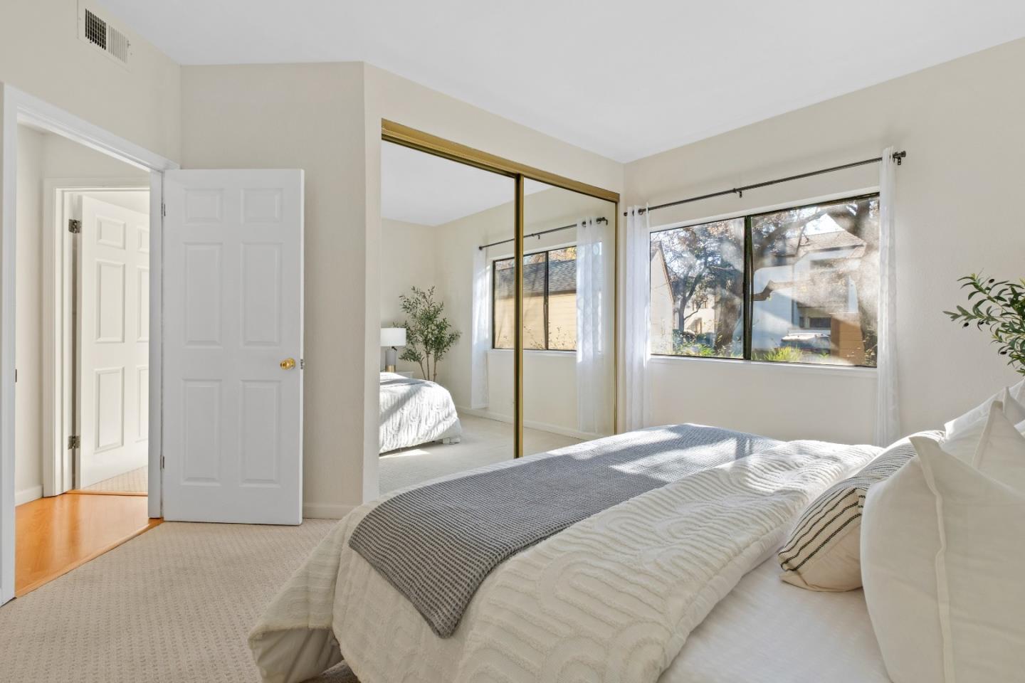 1392 Meadow Ridge Circle San Jose, CA 95131 - Photo 21 of 43 a bedroom with a large bed and a window