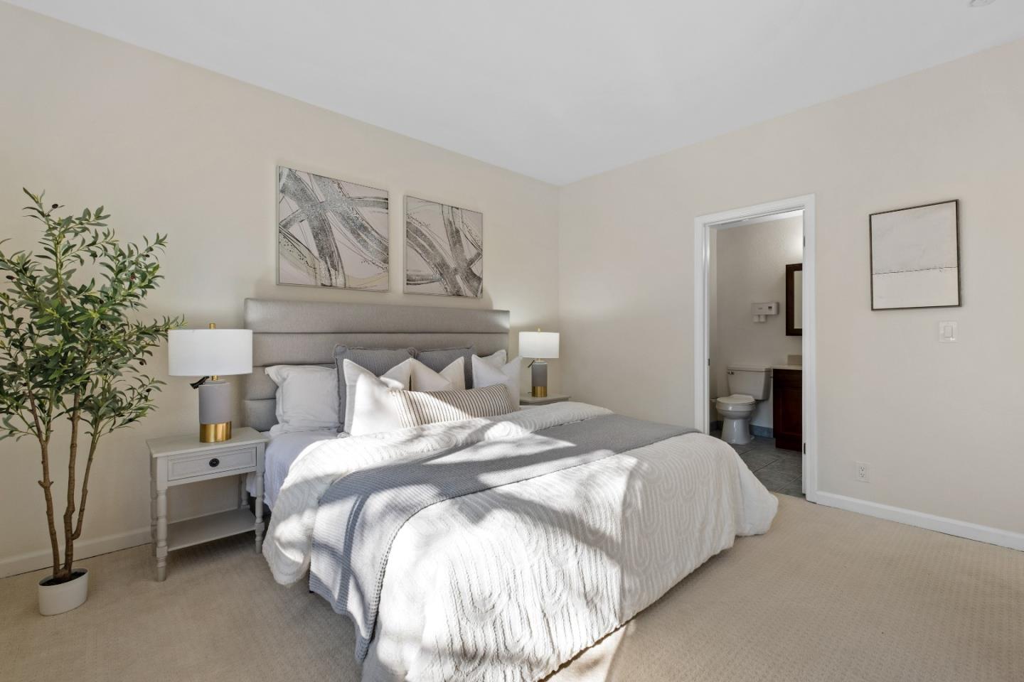 1392 Meadow Ridge Circle San Jose, CA 95131 - Photo 22 of 43 a bedroom with bed and a potted plant