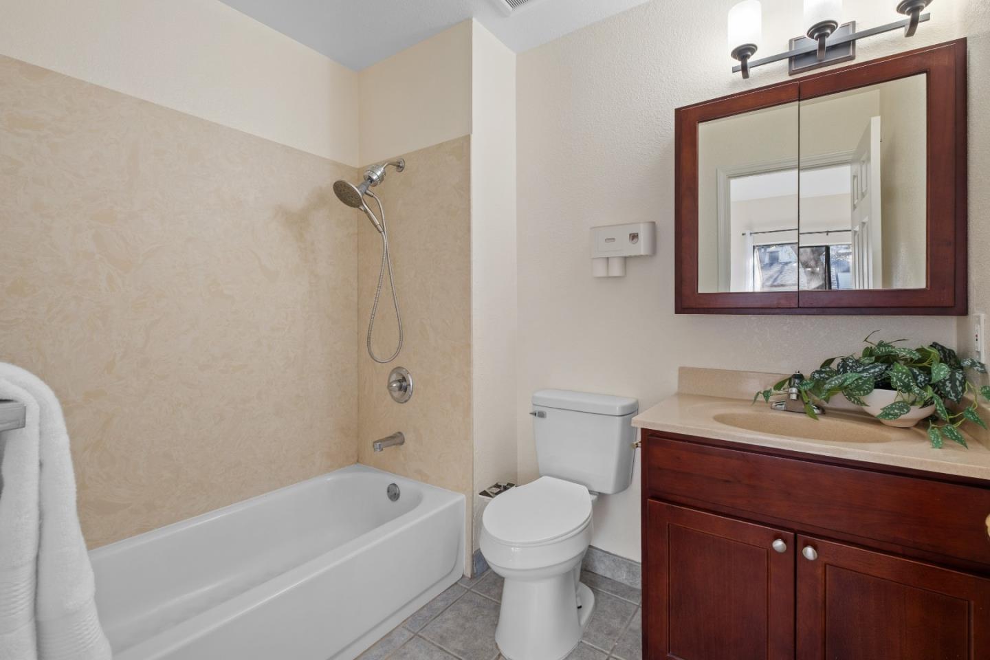 1392 Meadow Ridge Circle San Jose, CA 95131 - Photo 23 of 43 a bathroom with a sink a toilet and shower