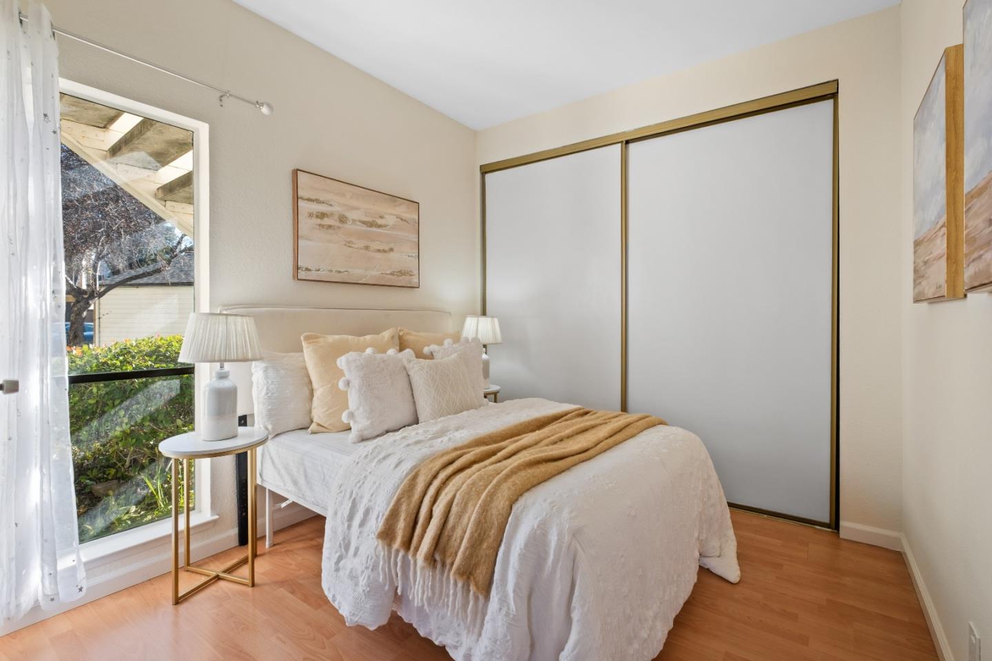 1392 Meadow Ridge Circle San Jose, CA 95131 - Photo 24 of 43 a bedroom with a bed painting and a large window
