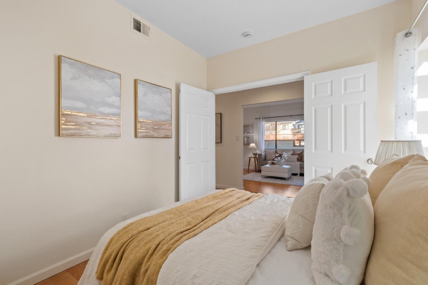 1392 Meadow Ridge Circle San Jose, CA 95131 - Photo 26 of 43 a bedroom with a bed and a painting on the wall