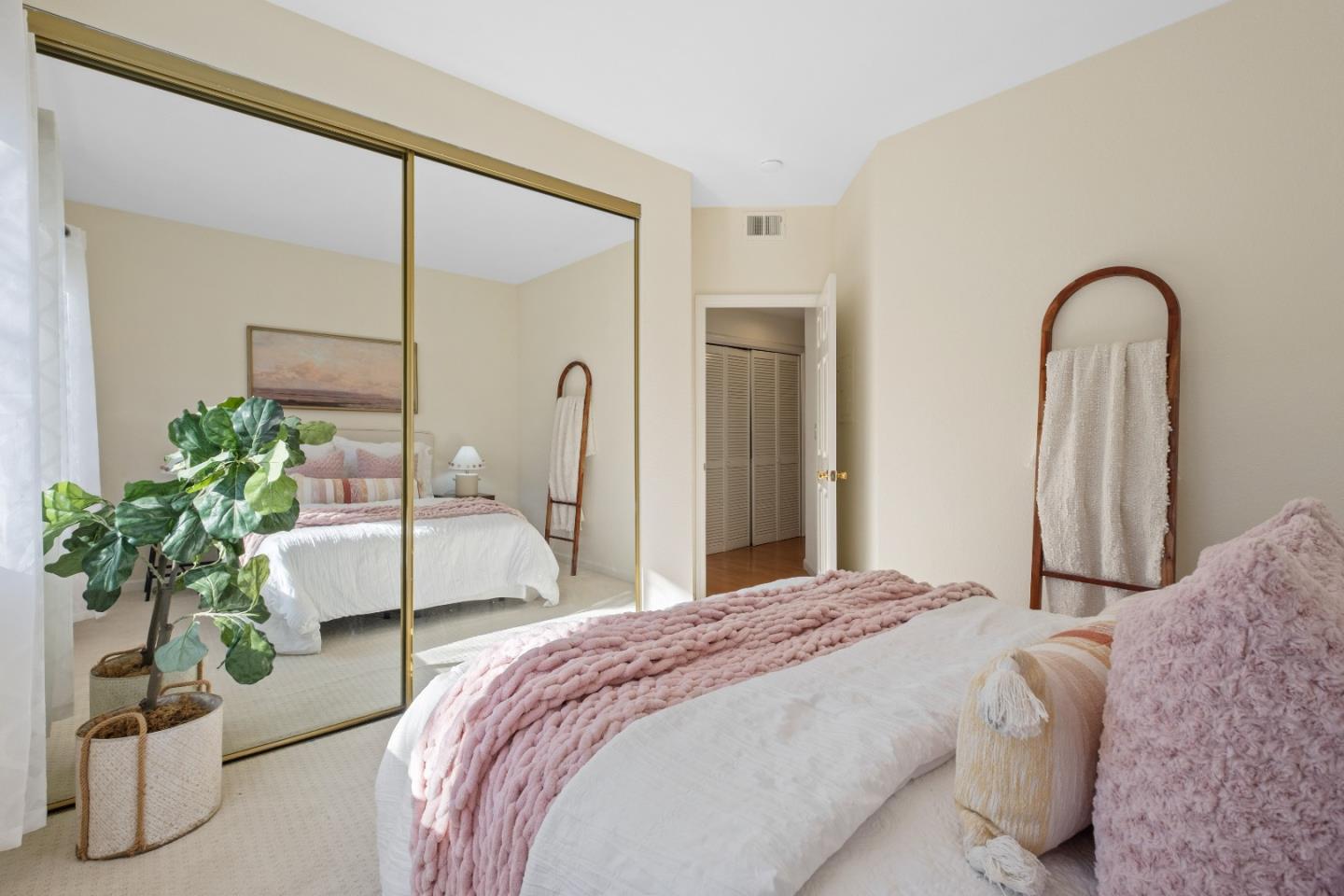 1392 Meadow Ridge Circle San Jose, CA 95131 - Photo 28 of 43 a bedroom with a bed and a potted plant