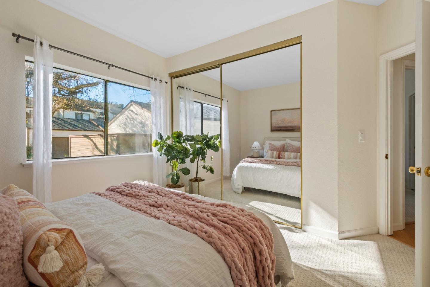 1392 Meadow Ridge Circle San Jose, CA 95131 - Photo 29 of 43 a bedroom with a bed and a large window