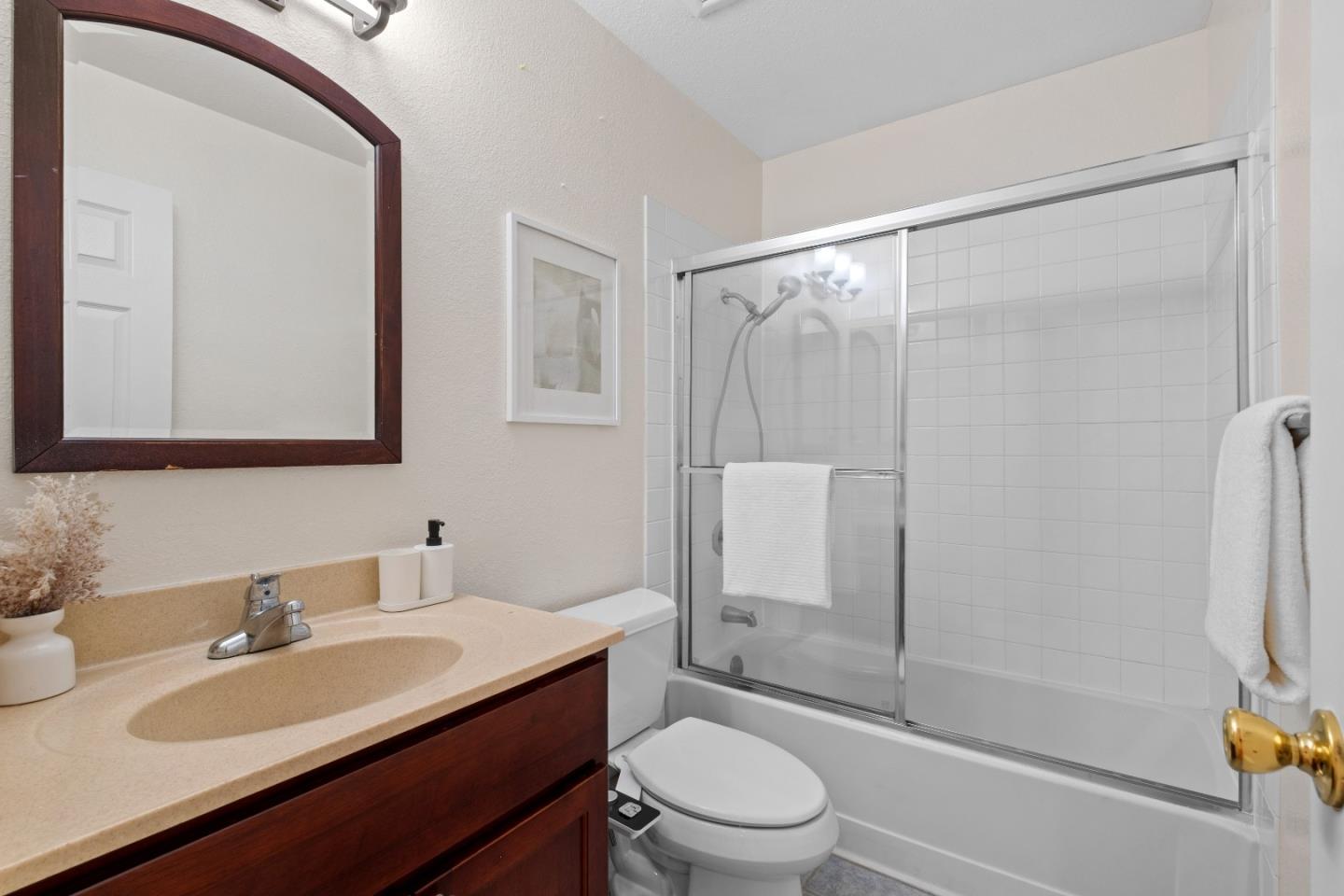 1392 Meadow Ridge Circle San Jose, CA 95131 - Photo 30 of 43 a bathroom with a sink toilet a mirror and shower