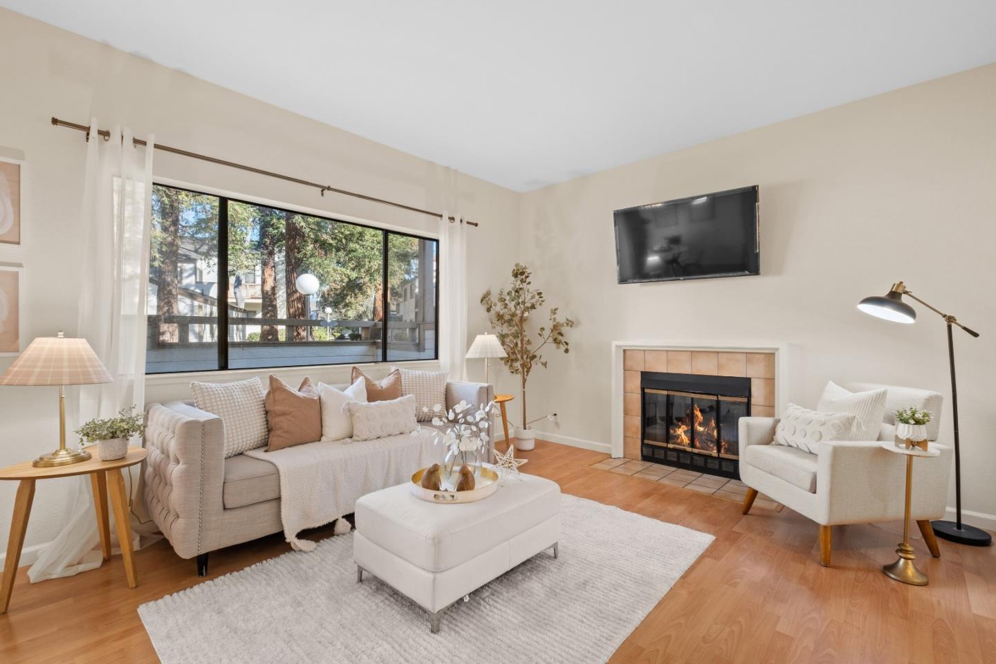 1392 Meadow Ridge Circle San Jose, CA 95131 - Photo 3 of 43 a living room with furniture a fireplace and a flat screen tv