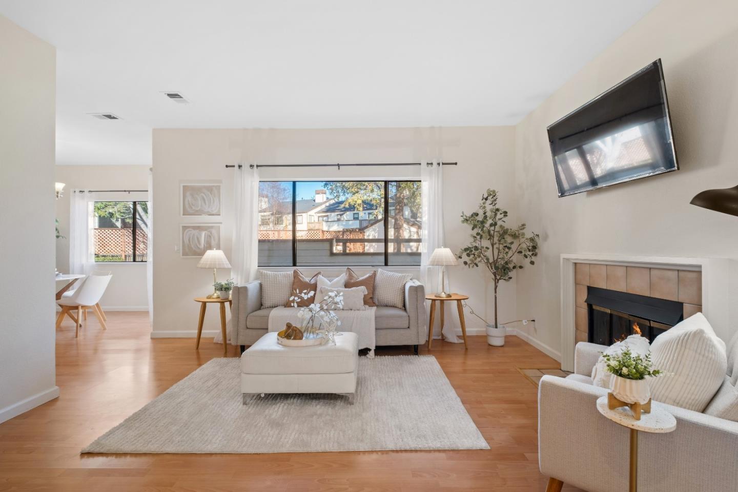 1392 Meadow Ridge Circle San Jose, CA 95131 - Photo 7 of 43 a living room with furniture fireplace and a large window