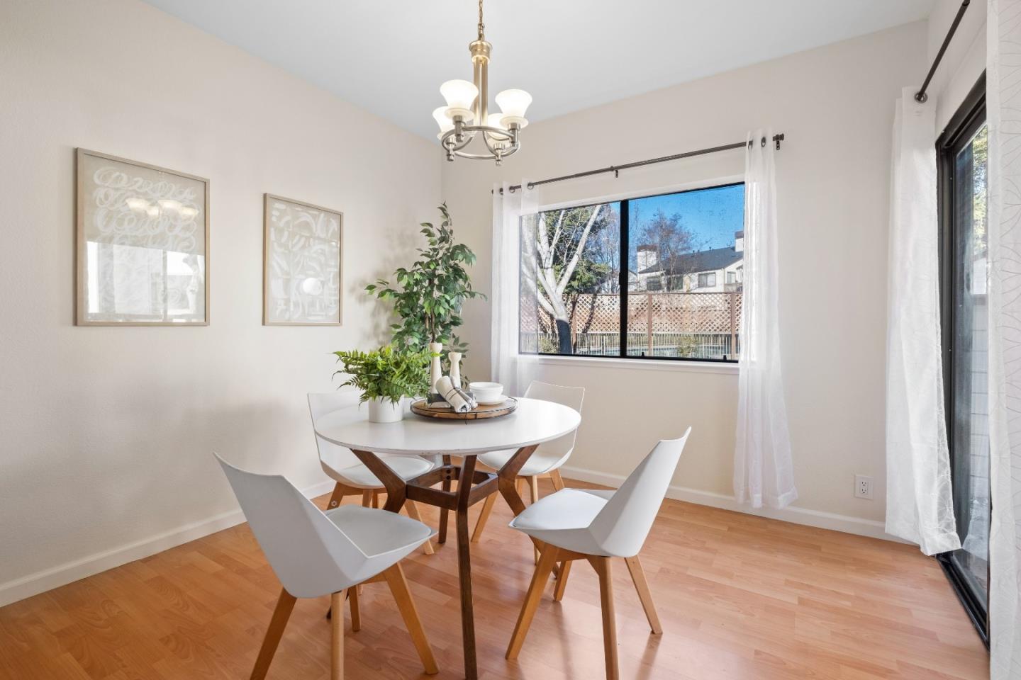 1392 Meadow Ridge Circle San Jose, CA 95131 - Photo 8 of 43 a view of a dining room with furniture and chandelier