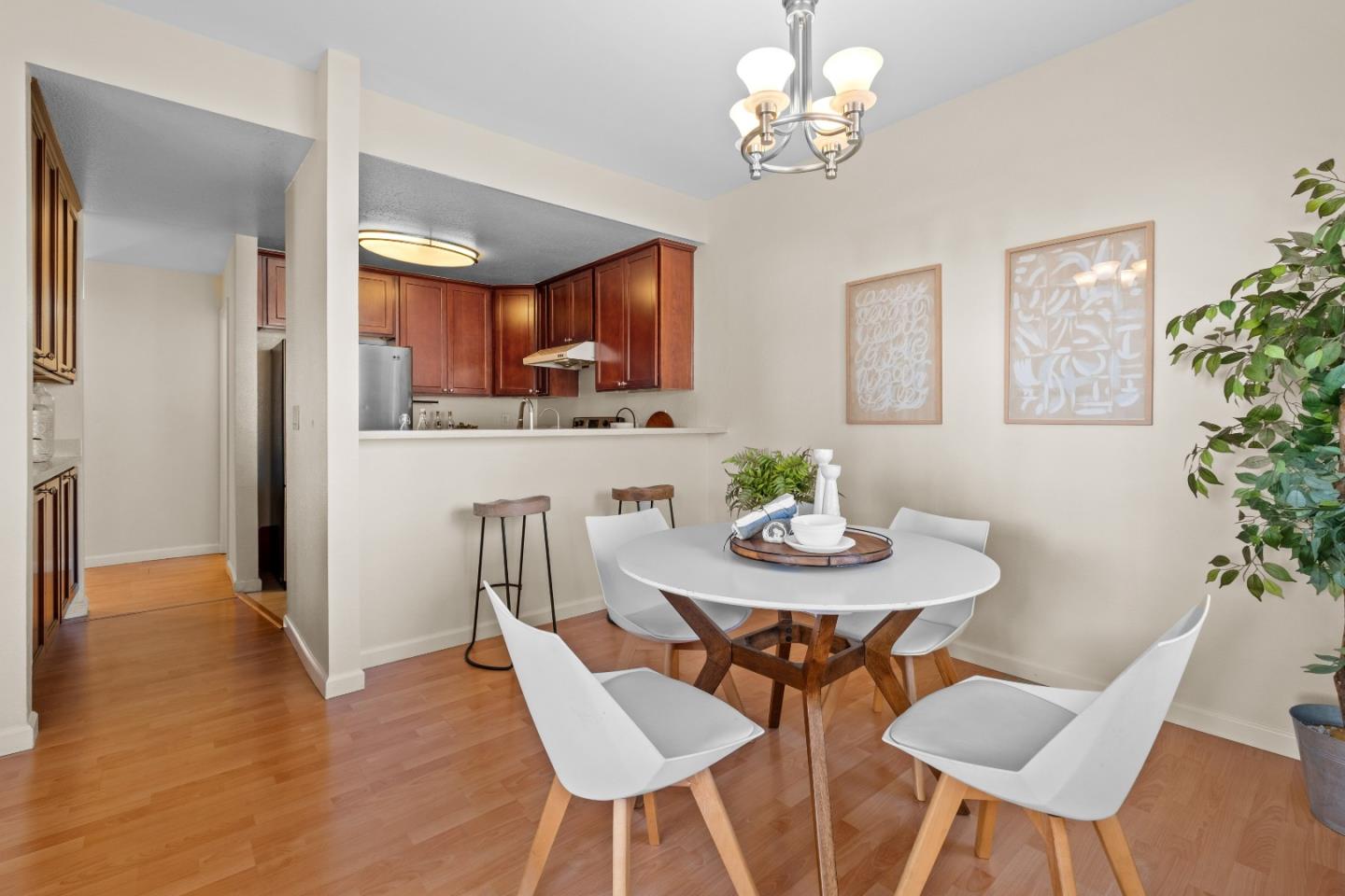 1392 Meadow Ridge Circle San Jose, CA 95131 - Photo 9 of 43 a view of a dining room with furniture and wooden floor