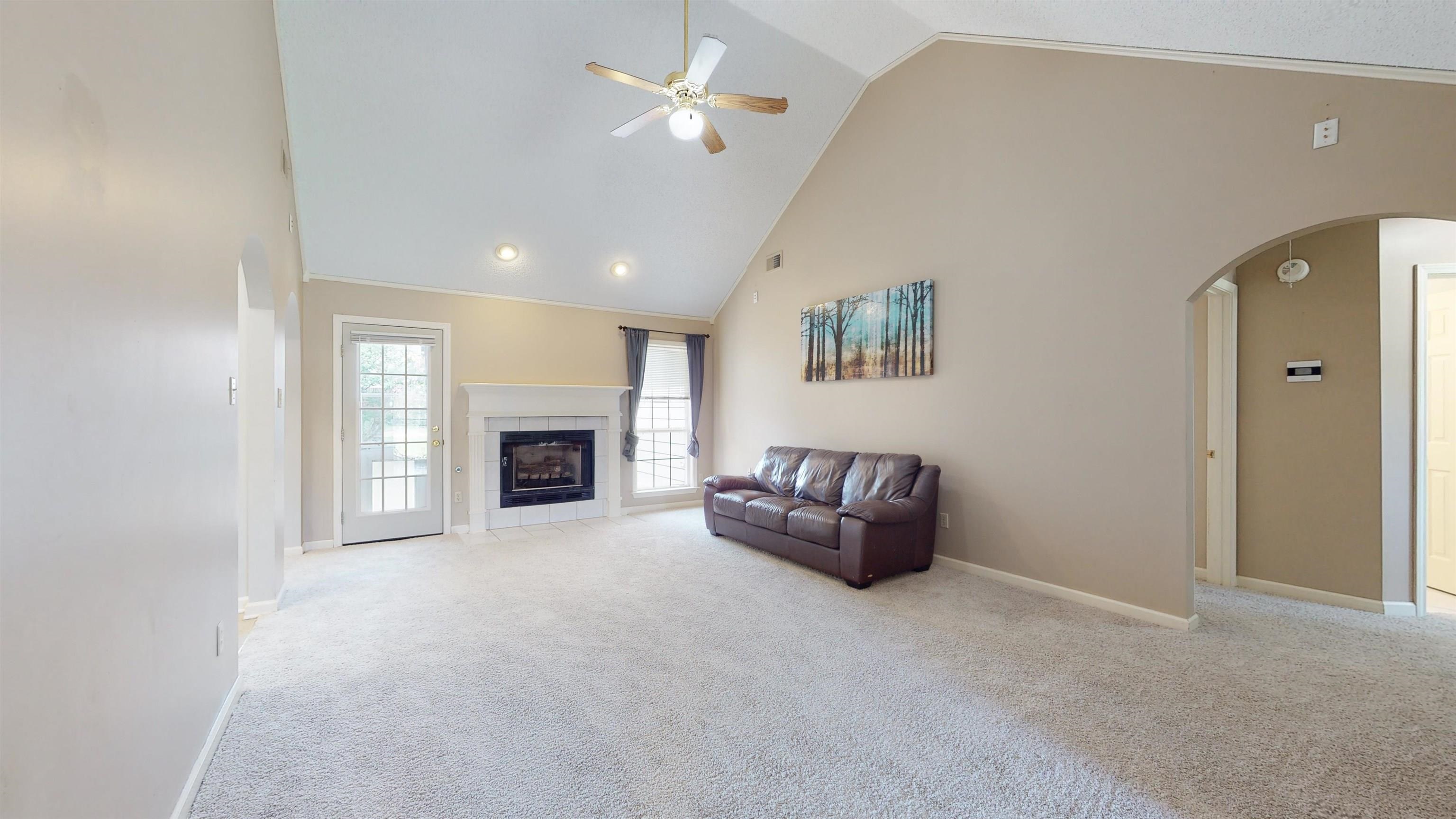 195 Cross Point Drive Collierville, TN 38017 - Photo 5 of 11 a living room with furniture and a fireplace