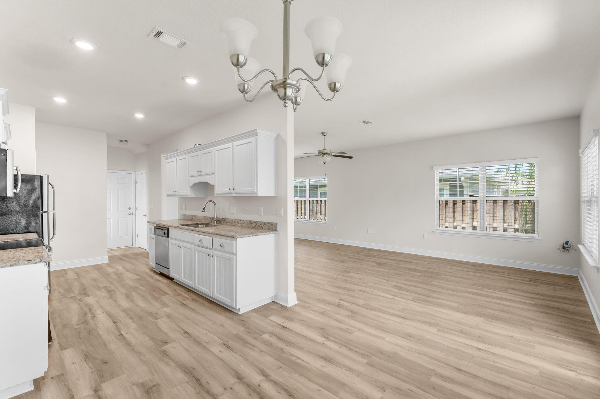 120 Brandywine Road Freeport, FL 32439 - Photo 11 of 29 a large kitchen with granite countertop a large counter top a sink stainless steel appliances and cabinets
