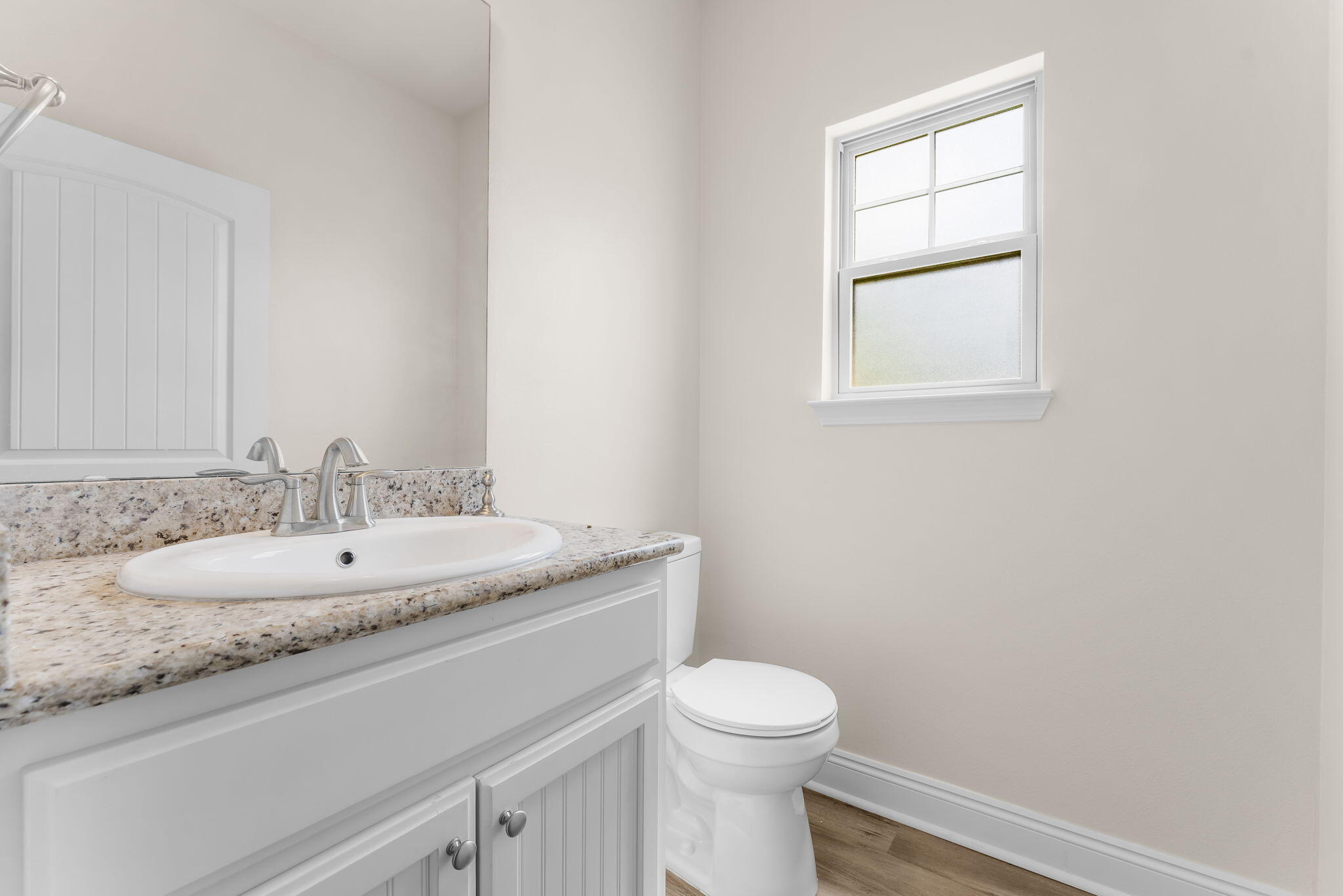120 Brandywine Road Freeport, FL 32439 - Photo 15 of 29 a bathroom with a granite countertop sink and a toilet