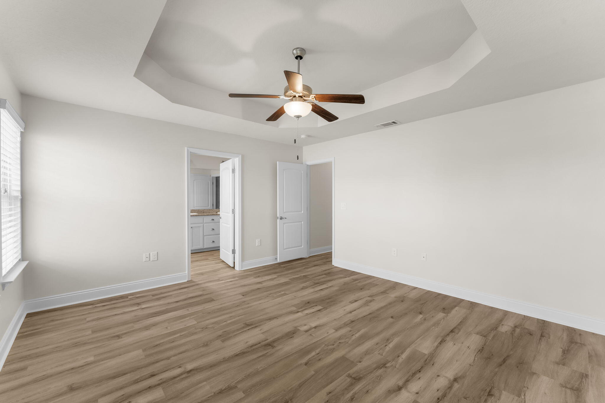 120 Brandywine Road Freeport, FL 32439 - Photo 23 of 29 a view of an empty room with window and wooden floor
