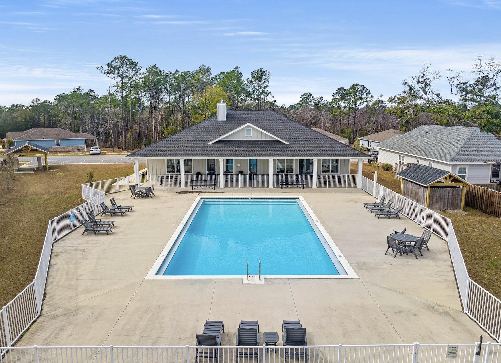 120 Brandywine Road Freeport, FL 32439 - Photo 4 of 29 swimming pool view with a seating space and a garden view