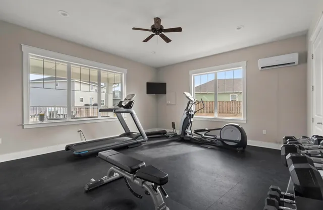 a room with gym equipment and a window
