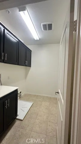 a view of a kitchen with a sink and dishwasher