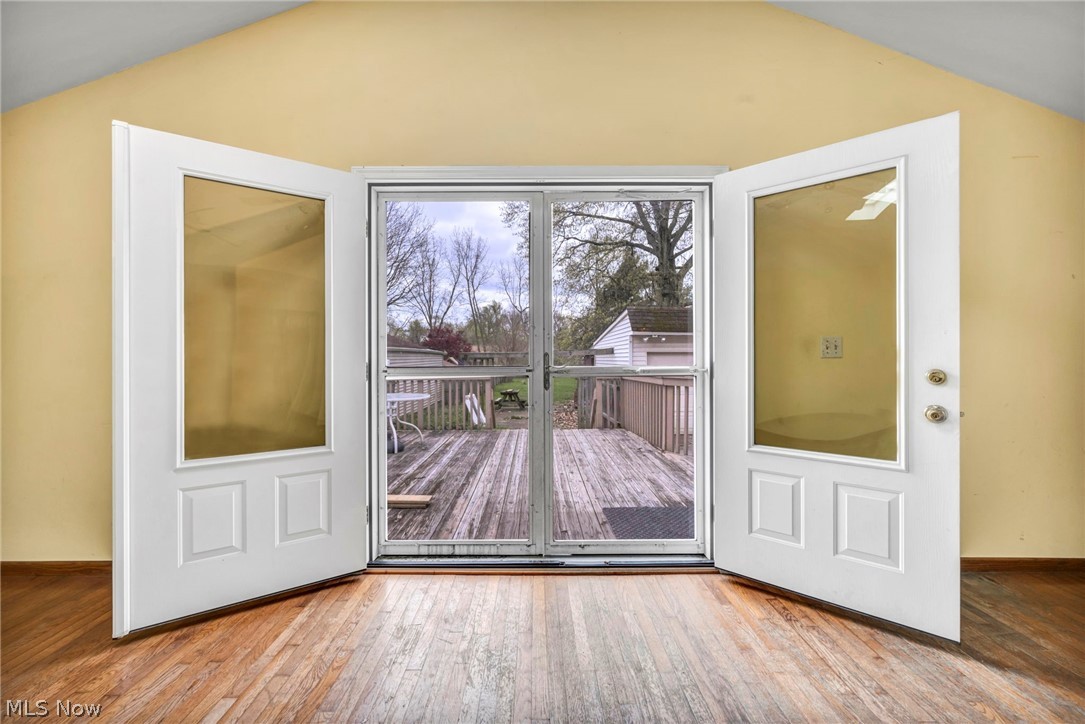 1011 Spring Road Cleveland, OH 44109 - Photo 26 of 47 Doorway featuring lofted ceiling and hardwood / wood-style flooring