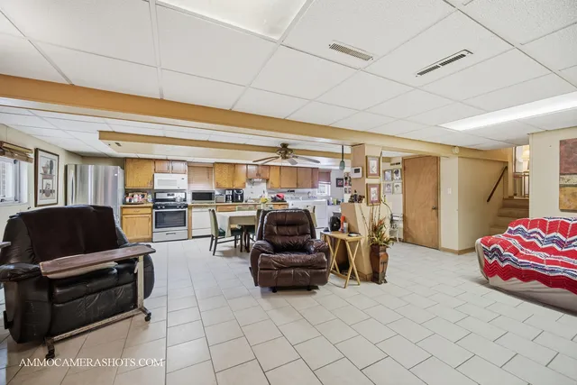 a living room with furniture and gym equipment