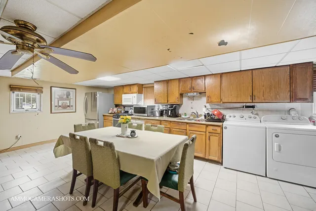 a kitchen with appliances cabinets and furniture