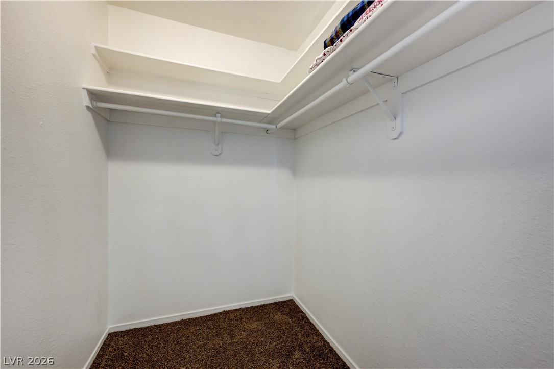 1751 East Reno Avenue, Unit 228 Las Vegas, NV 89119 - Photo 25 of 39 Functional closet space offers ample storage with integrated shelving and hanging rods.
