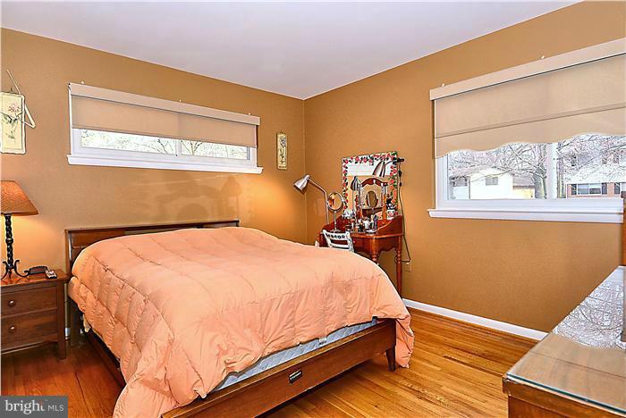 10804 Margate Road Silver Spring, MD 20901 - Photo 15 of 30 a bed sitting in a bedroom next to a window