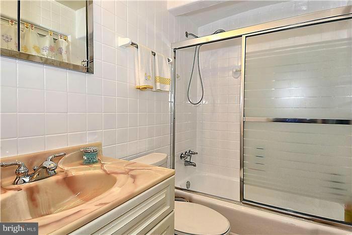 10804 Margate Road Silver Spring, MD 20901 - Photo 17 of 30 a bathroom with a sink and shower