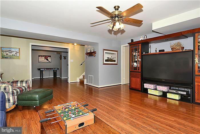 10804 Margate Road Silver Spring, MD 20901 - Photo 19 of 30 a living room with furniture and a flat screen tv