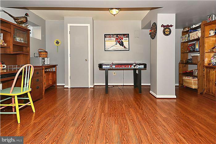 10804 Margate Road Silver Spring, MD 20901 - Photo 21 of 30 a room with furniture and wooden floor