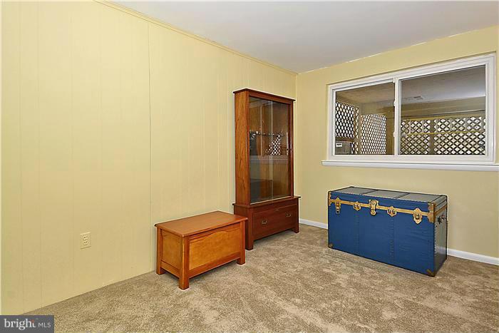 10804 Margate Road Silver Spring, MD 20901 - Photo 22 of 30 a living room with a couch and dresser