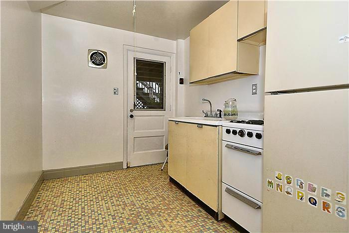 10804 Margate Road Silver Spring, MD 20901 - Photo 25 of 30 a kitchen with granite countertop a sink a stove and refrigerator
