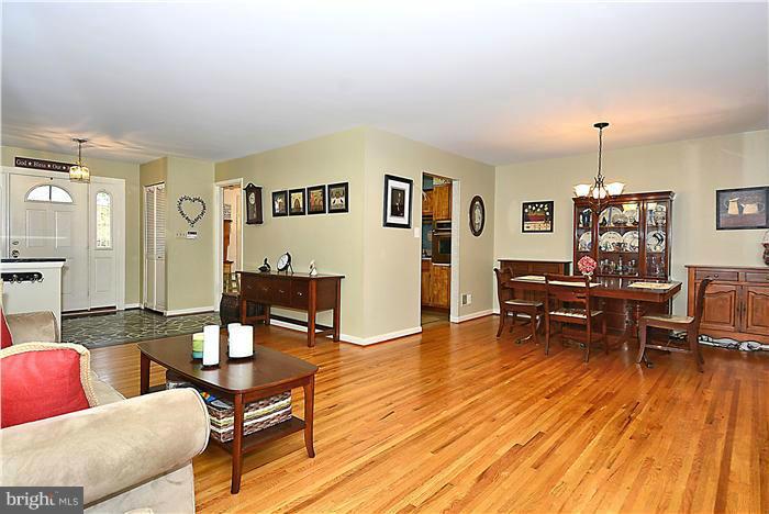 10804 Margate Road Silver Spring, MD 20901 - Photo 5 of 30 a living room with furniture and wooden floor
