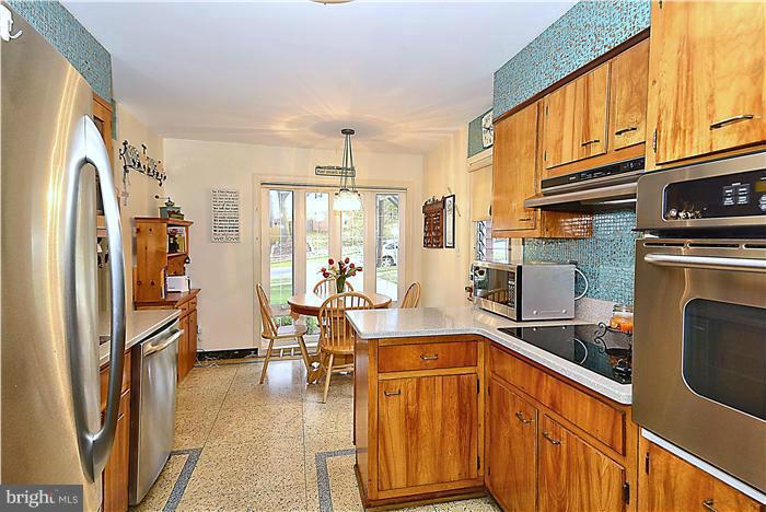 10804 Margate Road Silver Spring, MD 20901 - Photo 10 of 30 a kitchen with stainless steel appliances granite countertop a refrigerator a stove top oven and a sink