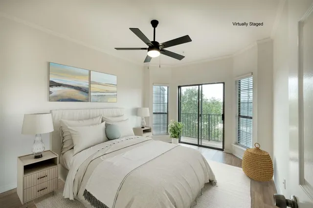 a bedroom with a large bed and a window