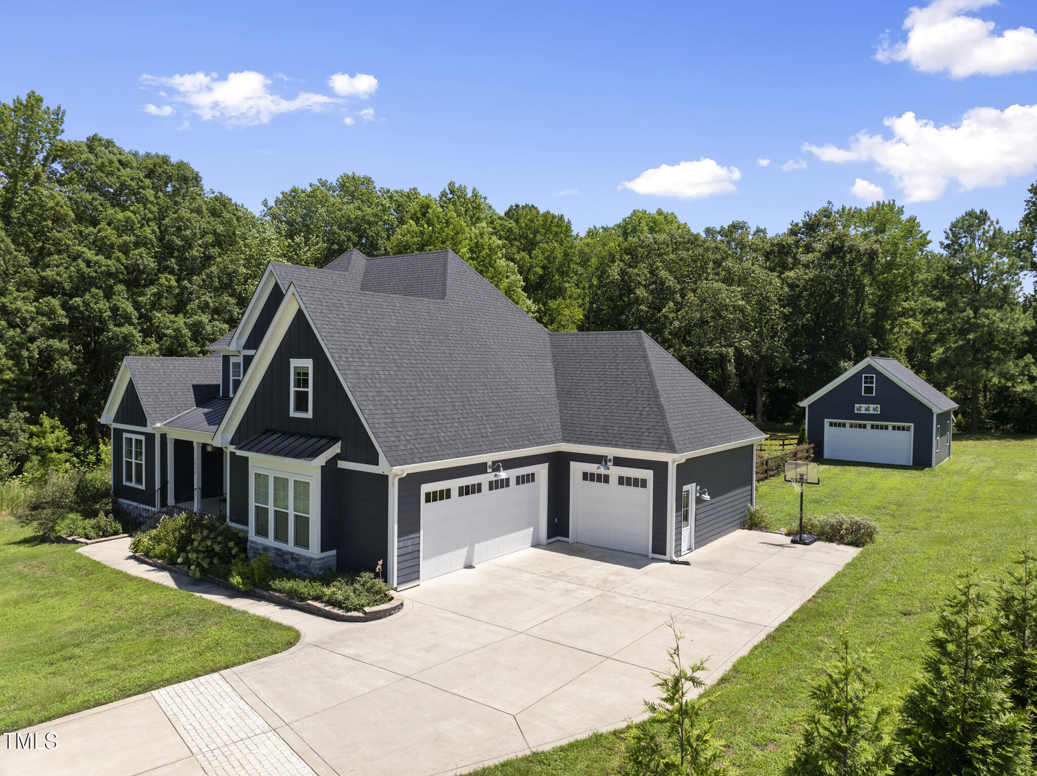 2416 Eddie Howard Road Willow Spring, NC 27592 - Photo 2 of 64 a aerial view of a house with yard and green space