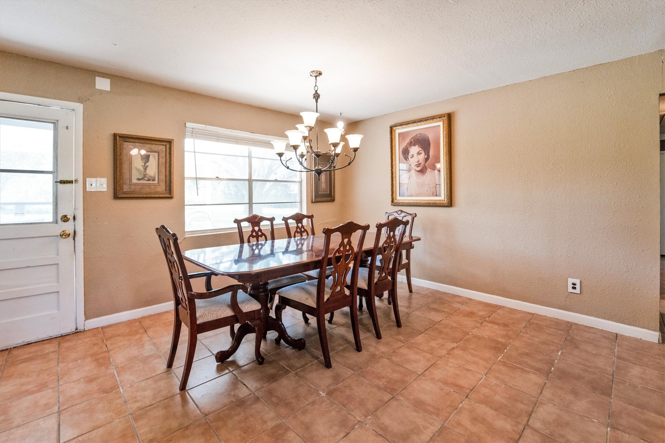 18111 Roy Long Road Pearland, TX 77584 - Photo 11 of 36 Enjoy meals together in this bright dining space accented by a chandelier and plenty of room for a large table.