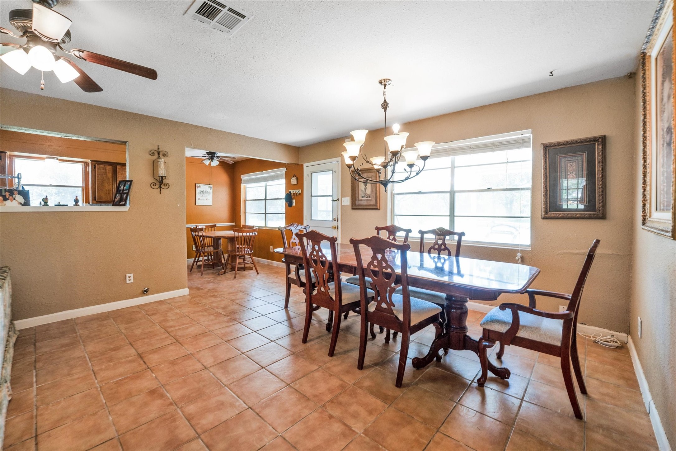 18111 Roy Long Road Pearland, TX 77584 - Photo 12 of 36 Open to the living room and kitchen, the dining area is ideal for hosting family dinners or casual get-togethers.