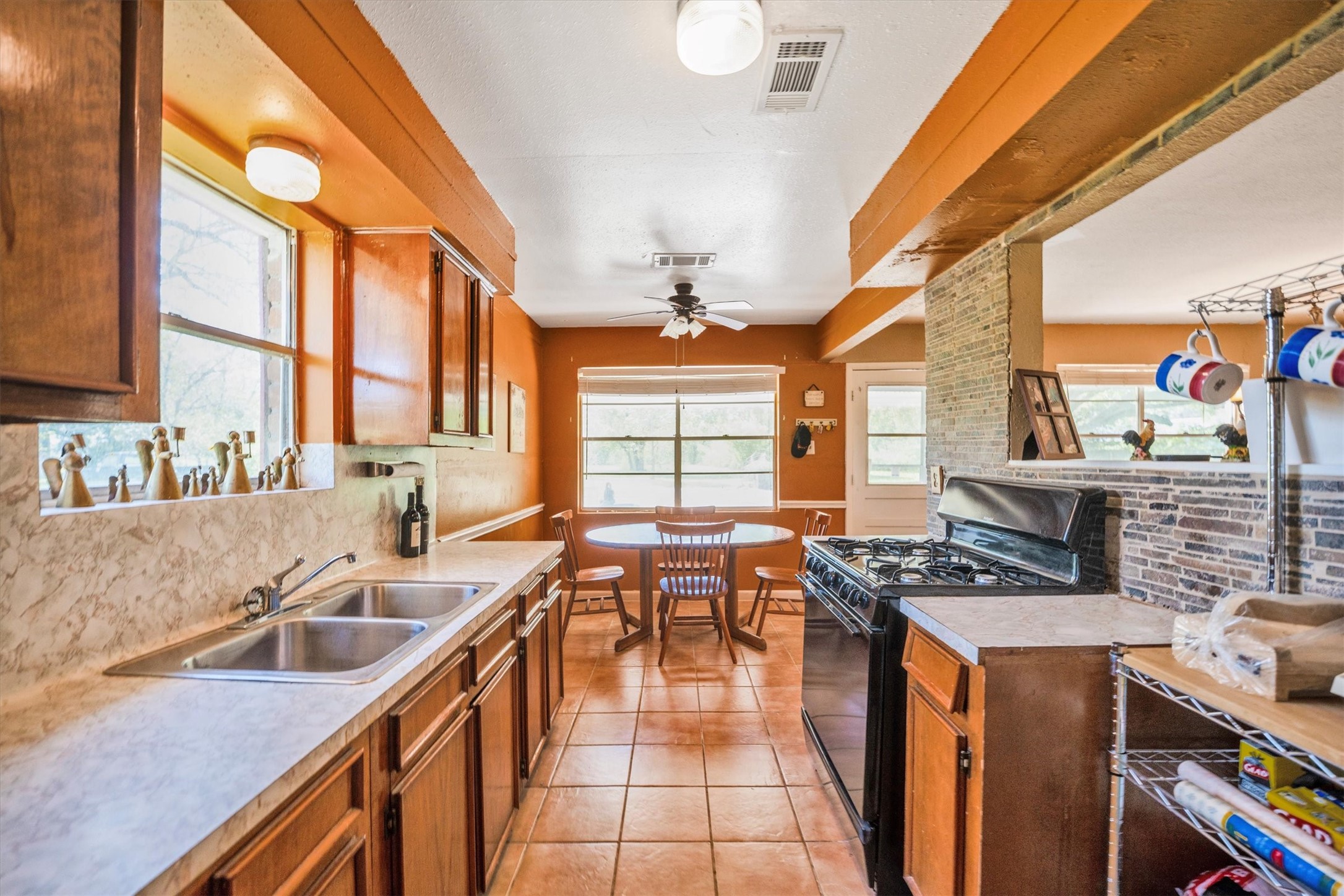 18111 Roy Long Road Pearland, TX 77584 - Photo 17 of 36 Just beyond the kitchen, the cozy breakfast nook is bathed in sunlight — the perfect spot for morning coffee or casual meals.
