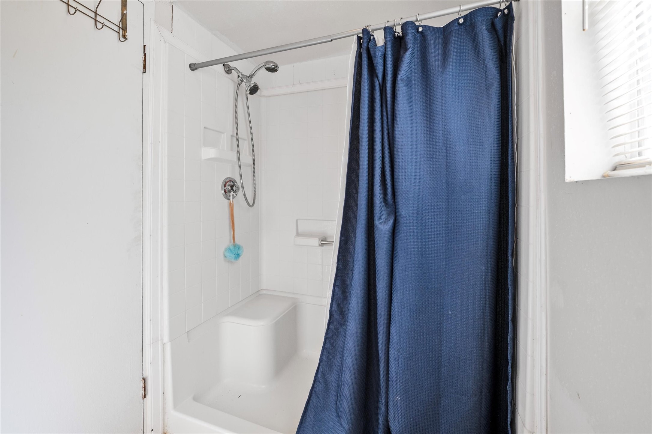 18111 Roy Long Road Pearland, TX 77584 - Photo 23 of 36 Clean and simple shower with built-in shelving and bright lighting, ready for everyday use.