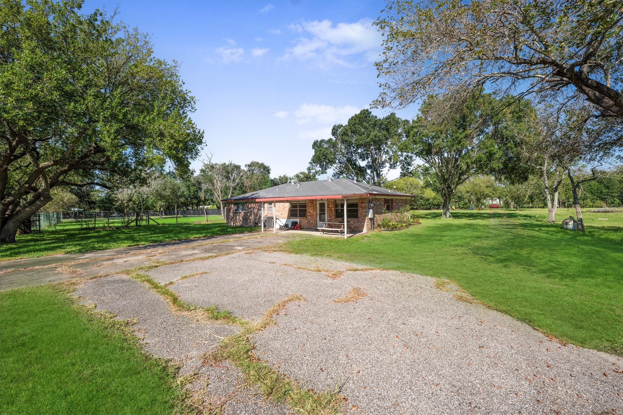 18111 Roy Long Road Pearland, TX 77584 - Photo 30 of 36 Surrounded by nature and open skies, this property offers a rare blend of privacy, space, and everyday comfort.