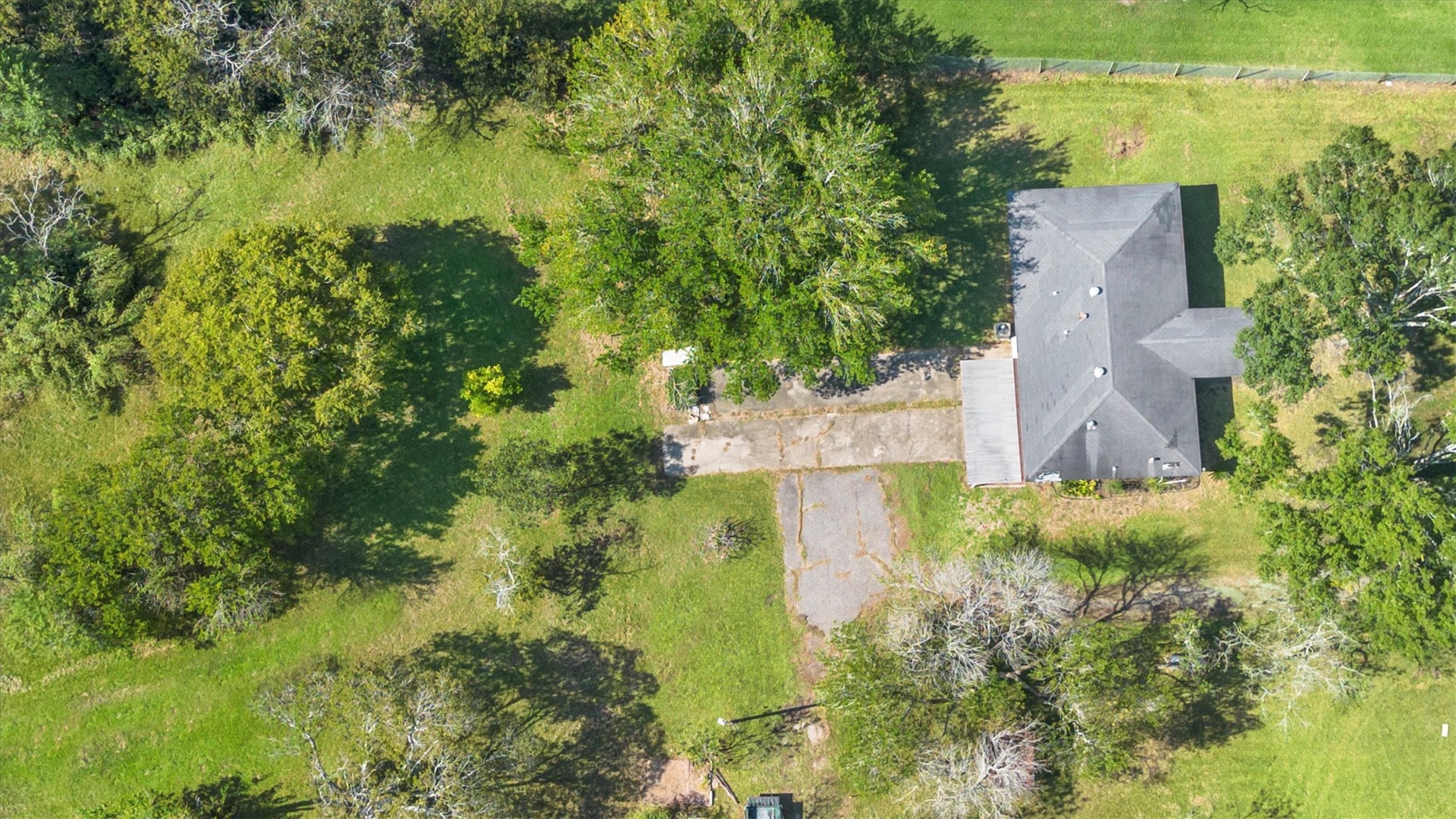 18111 Roy Long Road Pearland, TX 77584 - Photo 34 of 36 A detailed overhead view reveals the spacious home site, mature shade trees, and large yard area — perfect for entertaining, recreation, or simply enjoying nature.