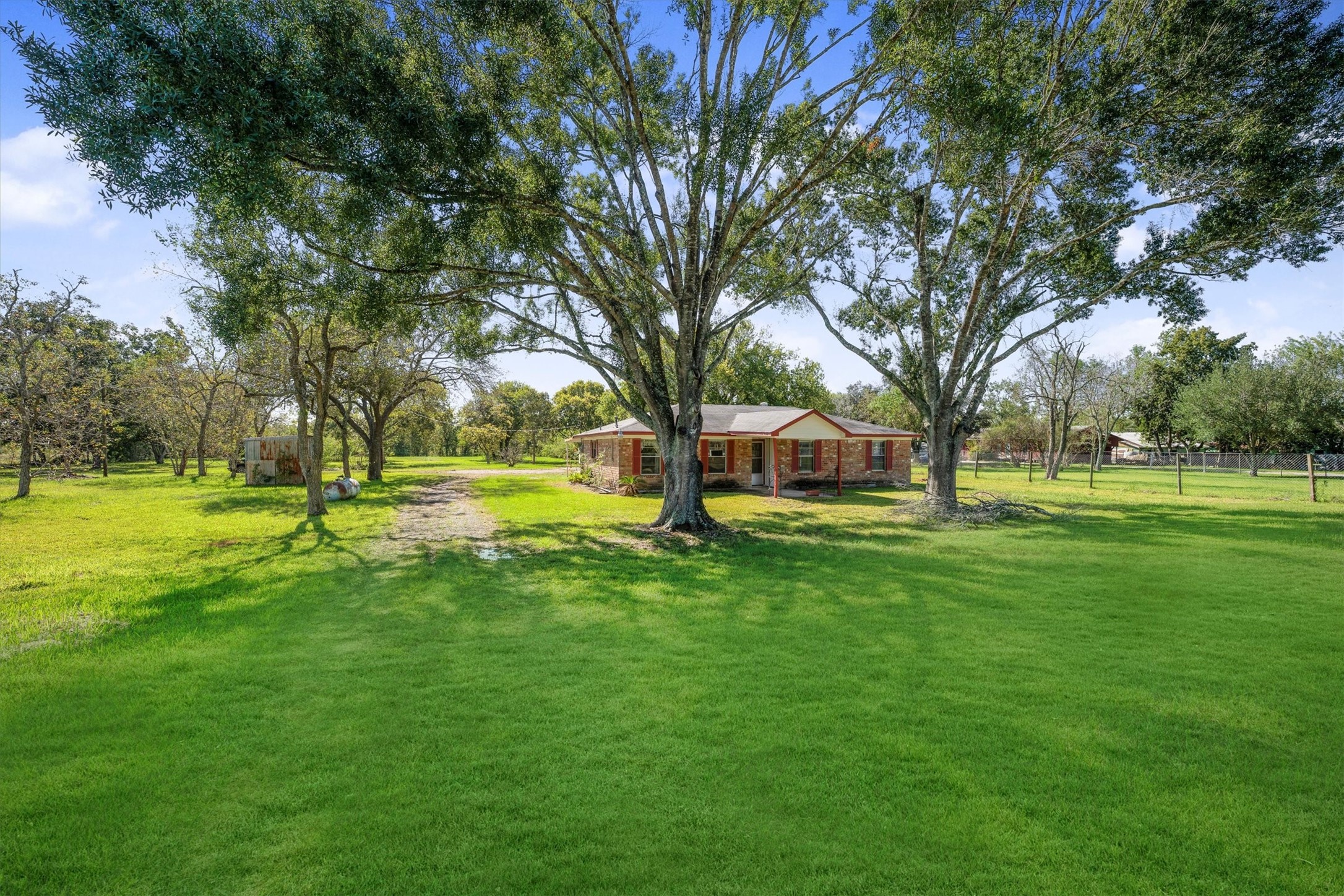18111 Roy Long Road Pearland, TX 77584 - Photo 4 of 36 Expansive yard stretches out in every direction — perfect for morning walks, outdoor play, or watching the sunset from your porch.