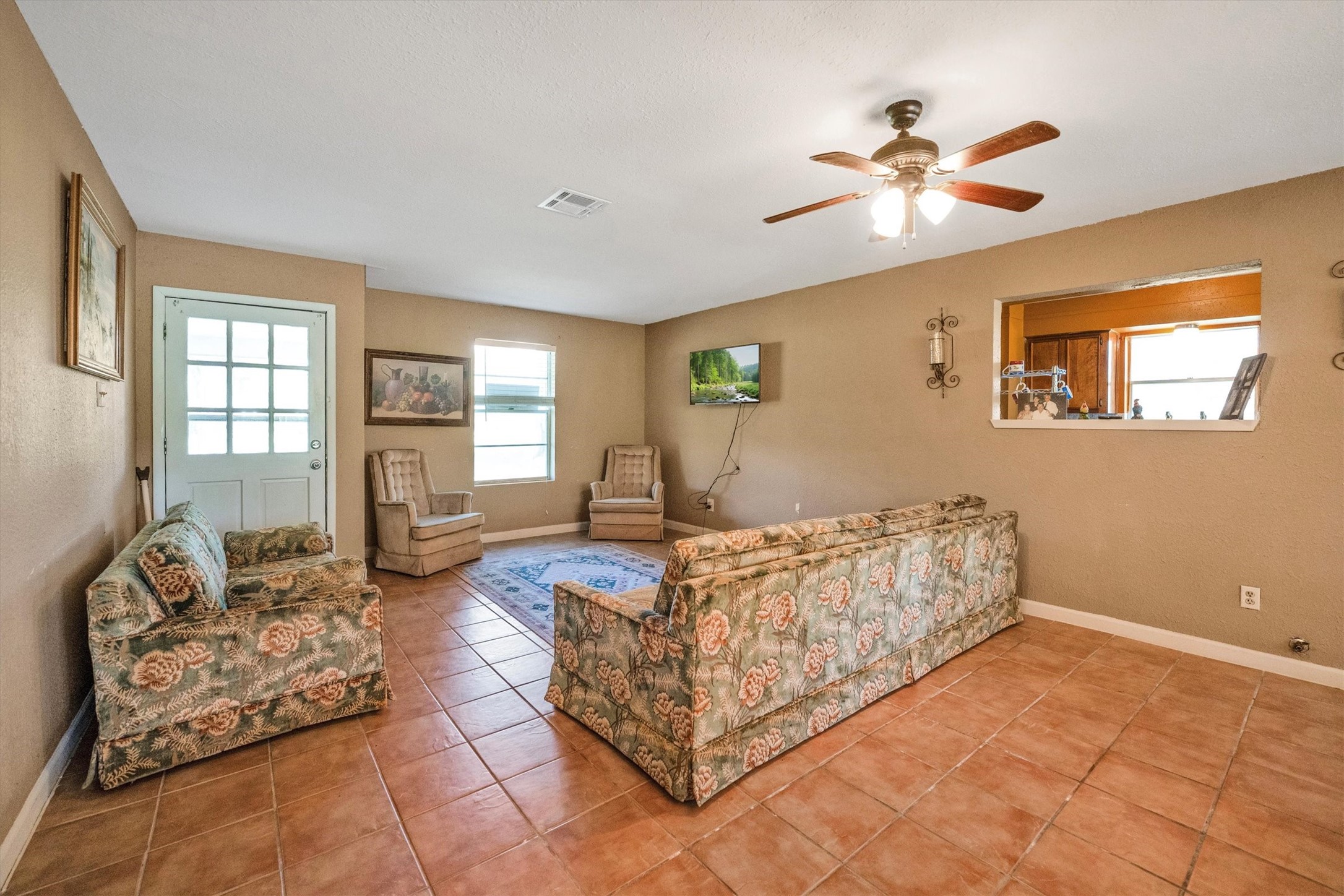 18111 Roy Long Road Pearland, TX 77584 - Photo 9 of 36 Spacious and filled with natural light, this comfortable living area invites you to relax and gather with loved ones.