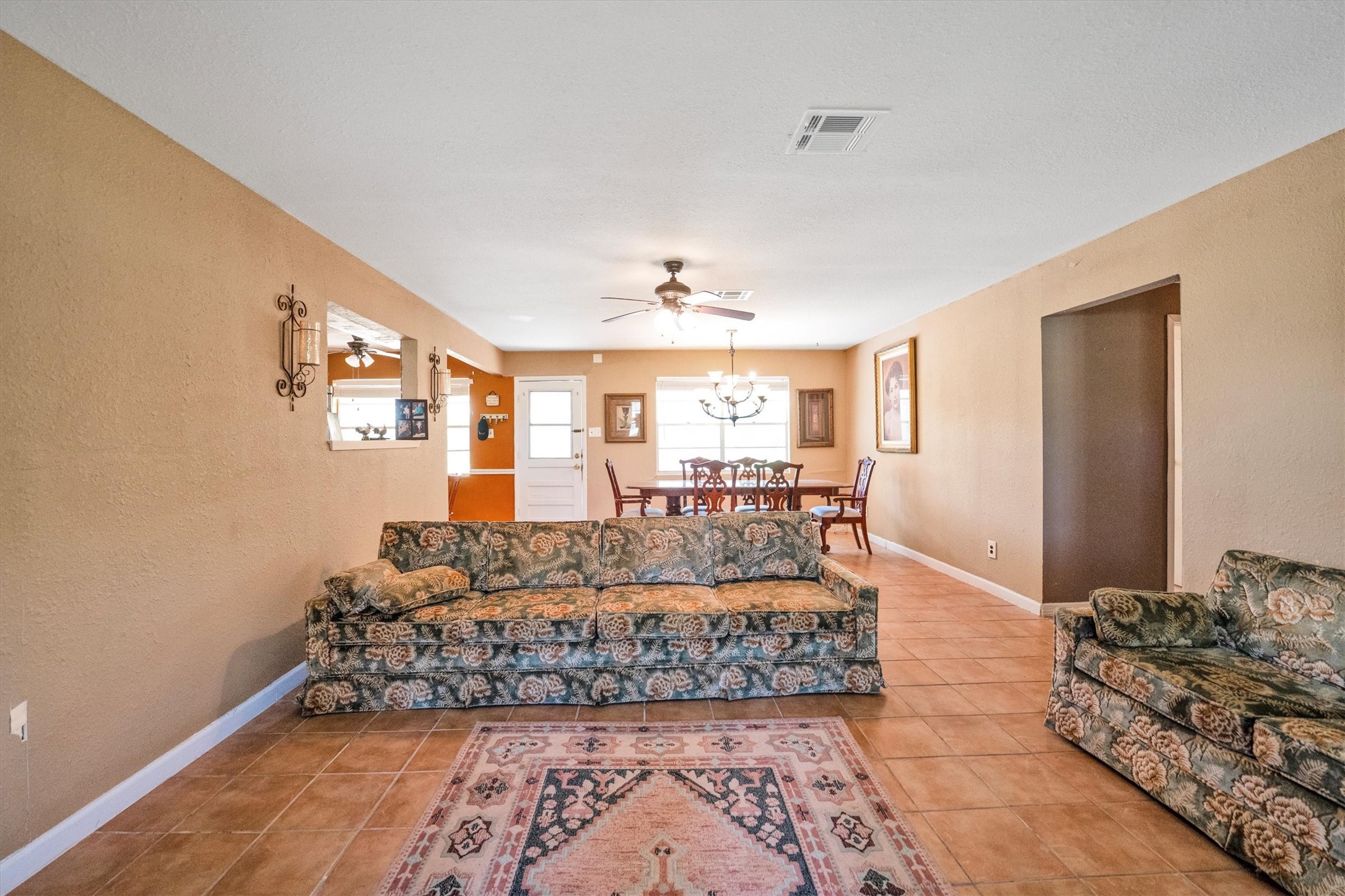 18111 Roy Long Road Pearland, TX 77584 - Photo 10 of 36 The open layout connects effortlessly to the dining area, creating a cozy space for both everyday living and entertaining.