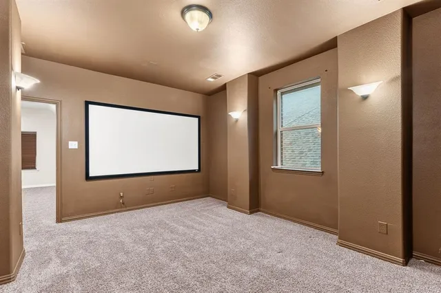 a view of an empty room with windows